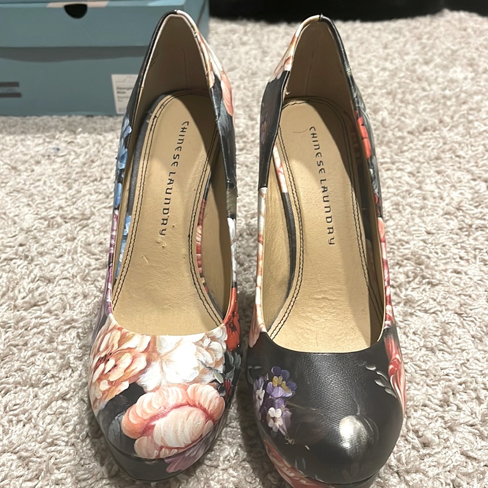 Black and floral pumps